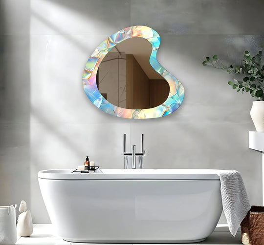 An asymmetric mirror with abstract rainbow colors including blue and a modern iridescent fragmented design is visible on a sleek gray wall