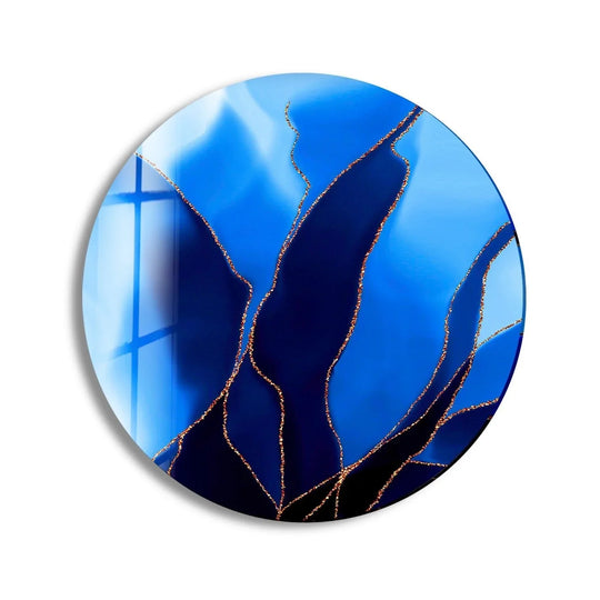 The darkest area of the abstract round black and blue glass wall art showcases the swirling design, a dramatic contrast enhanced by the light-catching glass art painting.