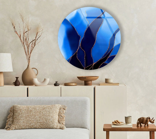 Featuring an abstract interplay of blues and blacks with metallic accents, this round glass creates captivating wall art prints with its mesmerizing and modern aesthetic.