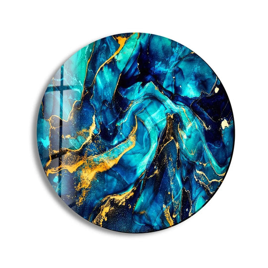 Dominant blues and teals swirl together in this abstract round glass art painting, accented by luxurious gold veining.