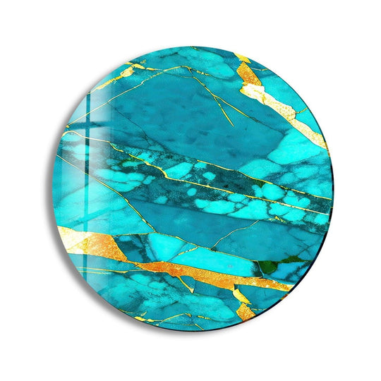 High-quality tempered glass wall art showcases a round light blue and gold abstract design with intricate veining and a durable, glossy finish.