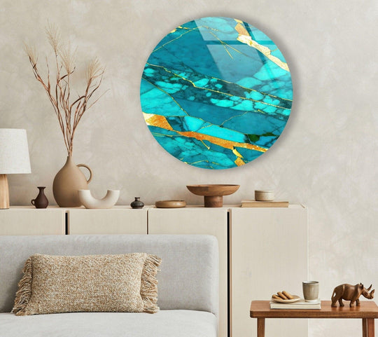 Flowing veins of gold accentuate the organic forms of abstract round light blue art from glass in this luxurious wall decor.