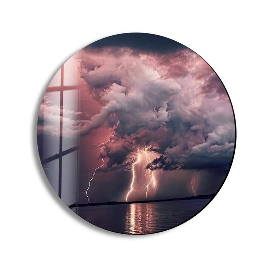 Predominantly pink and gray, this abstract round lightning glass art painting showcases an electrifying storm over the water.