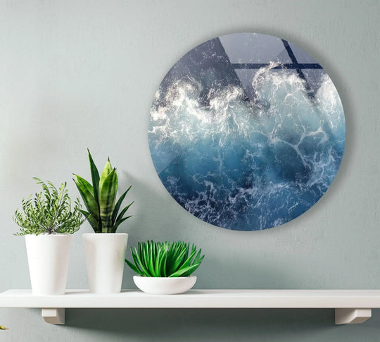 Horizontal shot of round wall prints featuring abstract ocean waves in shades of blue and white, adding a modern and coastal touch.