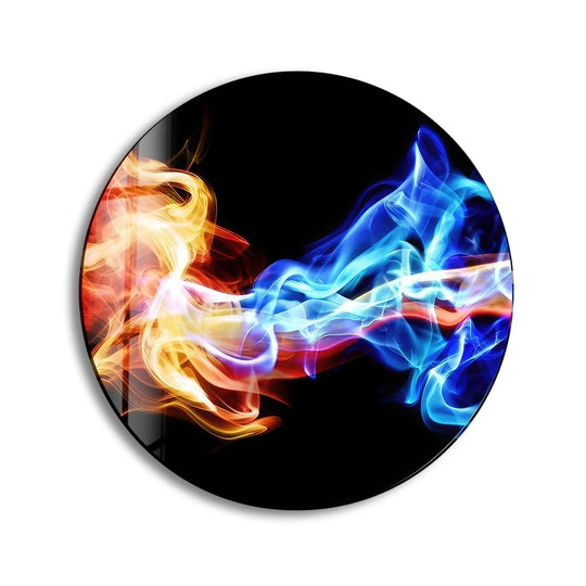 Vibrant color contrast defines this round glass wall art featuring abstract swirls of fiery orange juxtaposed with cool, calming blue hues for distinctive home decor.