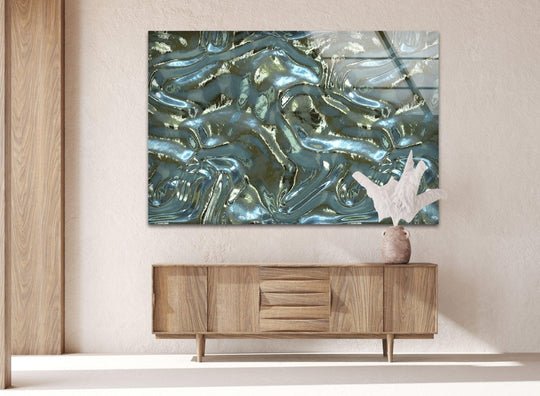 Realistic detail of abstract soft waves print wall art on a textured wall above a wooden cabinet.