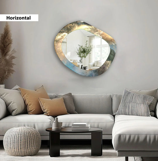 Abstract asymmetric wall mirror showcasing an abstract gold and blue cloud motif a modern artistic design and horizontal orientation