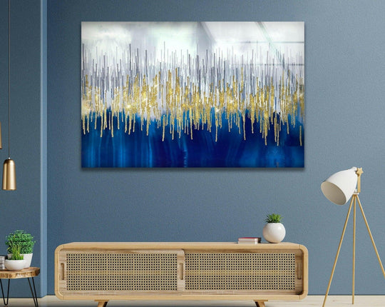 Abstract glass wall artwork features vertical geometric gold and silver lines dripping onto a navy blue background.