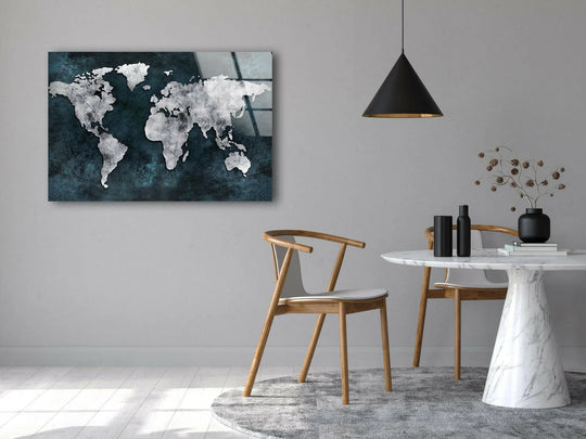 Abstract world map glass wall art decor creates visual rhythm with its textured deep blue background and stark white continents.