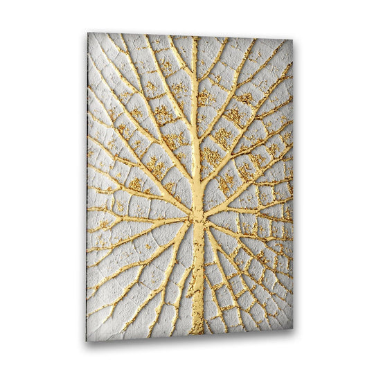 Close-up of the intricate golden veins of a leaf on textured white, highlighting its delicate structure as best glass art.