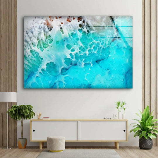 Aerial View of Ocean glass wall art shows an abstract seascape and turquoise blue tones and it is cool ocean art printed on glass