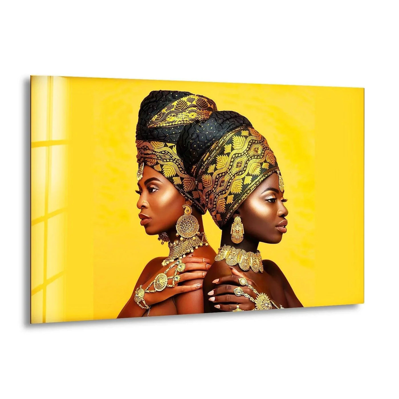 Vibrant yellow glass art showcases two regal African women in golden headwraps and ornate jewelry.