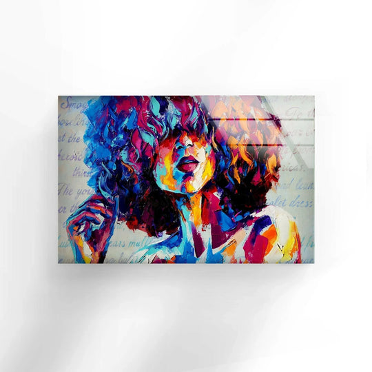 Vibrantly saturated Afro Woman glass wall artwork in bold, intense blues, pinks, and yellows captures a striking portrait.