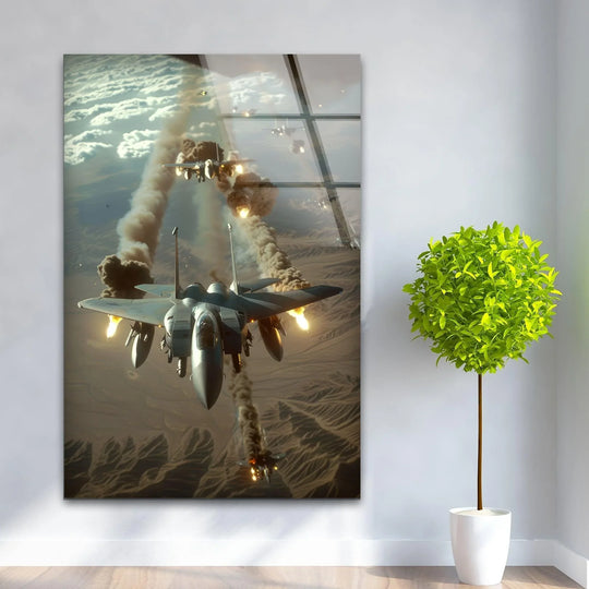 F-15 fighter jets engage in aerial combat amidst desert terrain, their fiery exhaust trails creating a stark color contrast against the muted tones of the art from glass.