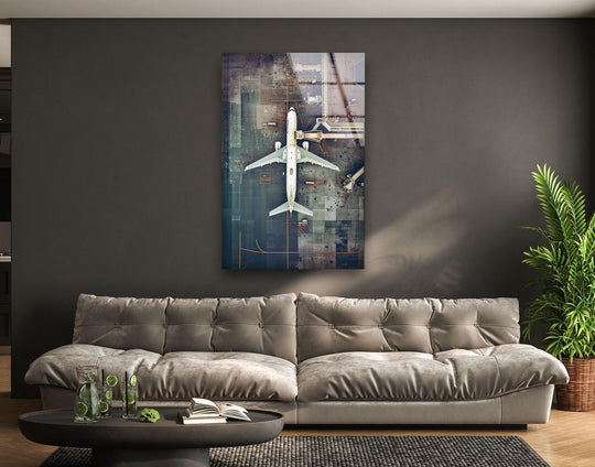 This vivid glass printing captures an airplane with rich, saturated blues and grays on the tarmac.