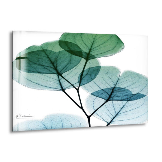 Flower glass wall art features a eucalyptus leaf motif in shades of green and blue and it is nature inspired decor with a mate finish