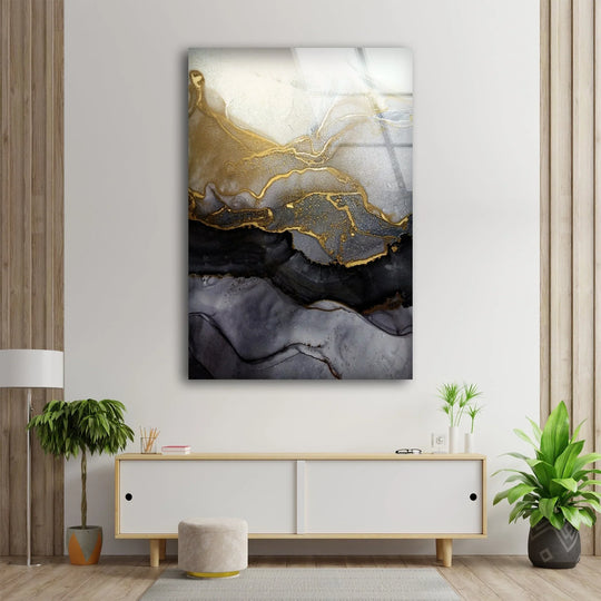 Glass wall art showcasing abstract swirls of black and gold ink with realistic metallic shimmer and textural depth.