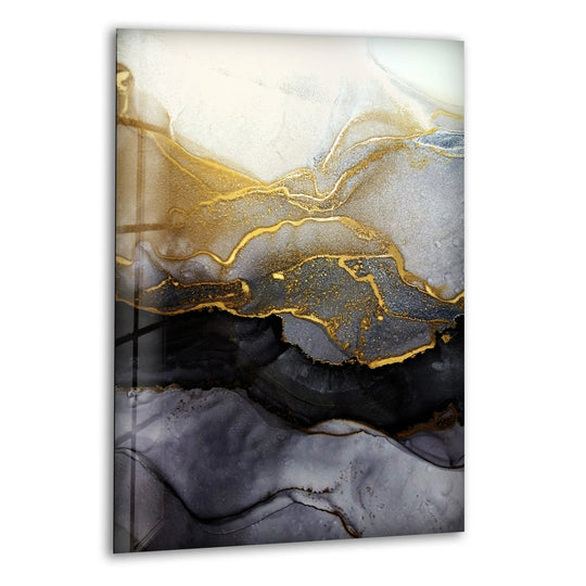 Glass wall art featuring flowing gold and pewter tones with deep obsidian accents.