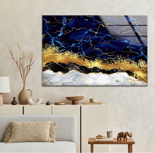 Serene navy and gold abstract marble glass hanging wall art evokes a sense of tranquil stillness.