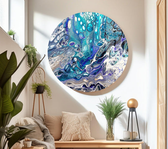 Dominant blue and turquoise hues swirl in an abstract alcohol ink glass wall art print.