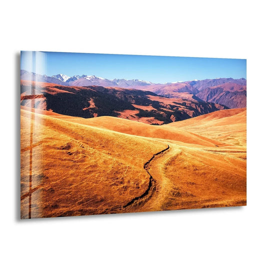 Golden hues dominate this Almaty Kazakhstan landscape glass wall art, offering a stunning wall prints view of rolling hills and distant mountains.