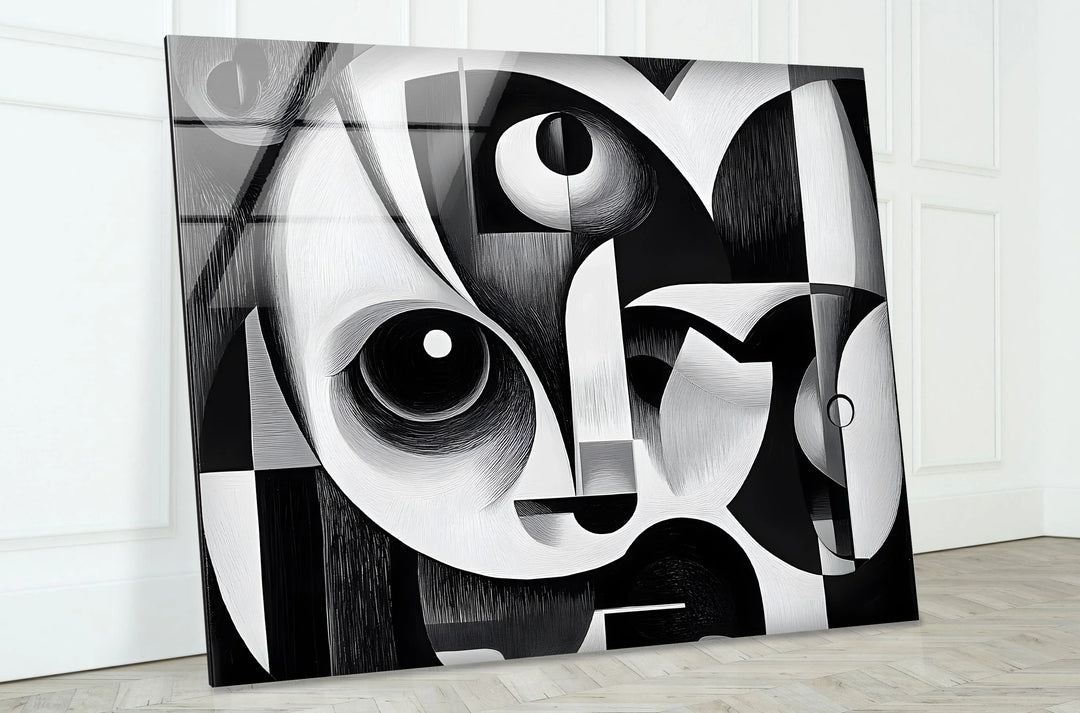 Monochrome abstract glass art portraying a reconstructed face using layered shapes and textures.