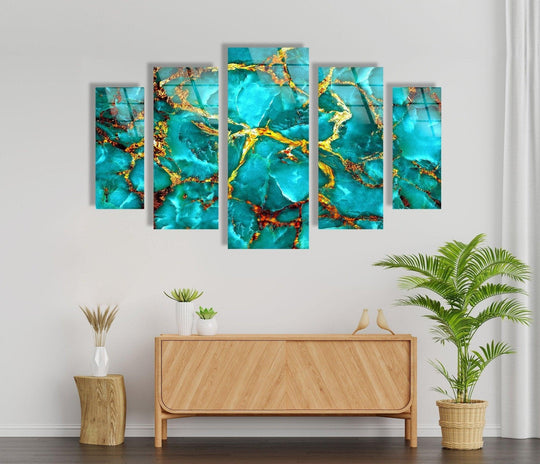 The fluid organic forms and azure hues mingle with glimmering gold veins in this five-panel Aqua Blue with Gold Veins Abstract Glass Wall Art, a piece of unique modern wall decor.