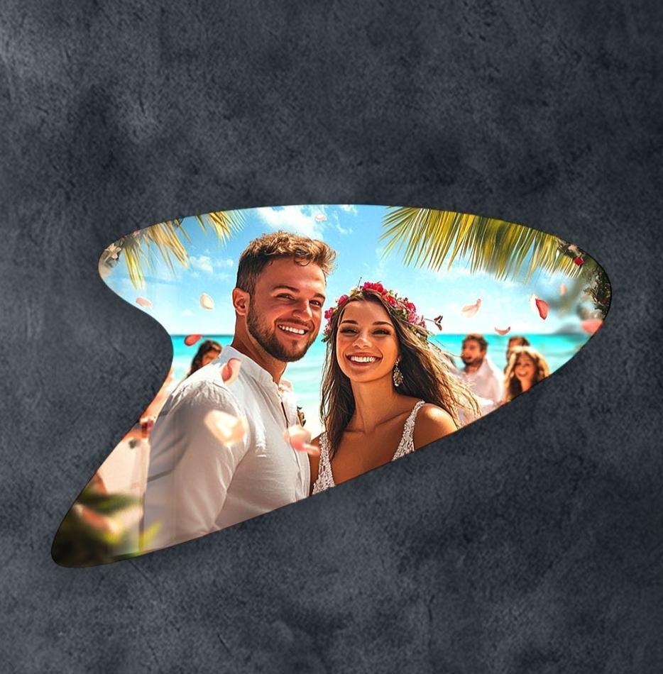 A unique abstract glass art piece captures a joyous beach wedding, showcasing exquisite material quality.