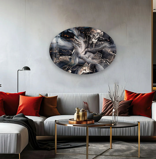 Fluid abstract glass wall art prints create a dynamic visual rhythm with swirling black, grey, and gold patterns.