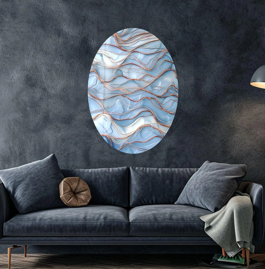 Oval glass wall artwork showcases a seamless transition from ethereal blues to subtle golden waves.