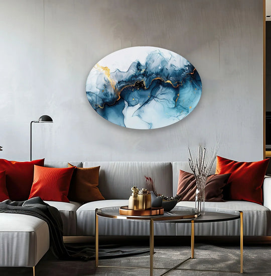 An asymmetric oval navy blue abstract glass print wall art featuring shimmering gold veins along its elegantly curved edges.