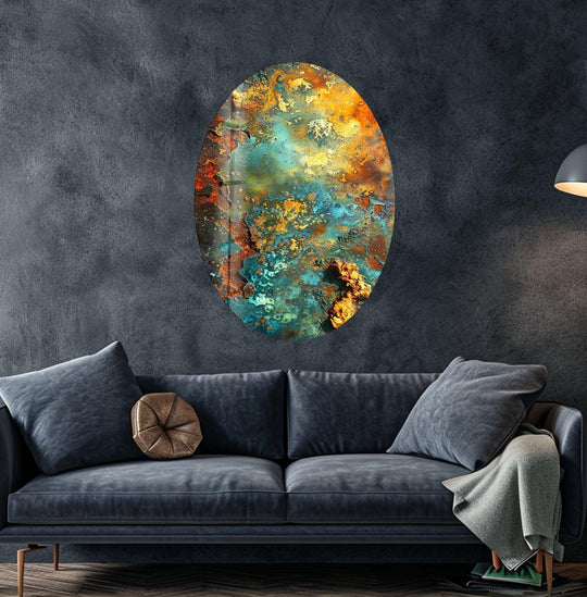 Asymmetric oval rusty abstract glass wall art prints with vibrant teal and golden hues.