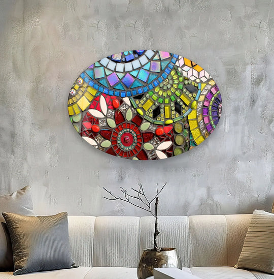 An oval mosaic of organic forms in vibrant stained glass printing art with intricate floral and geometric patterns.