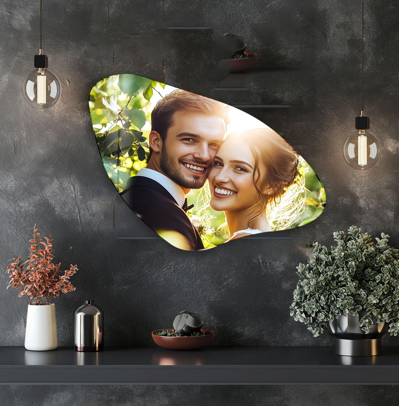 Richly saturated custom flowing leaf shape glass art showcases a joyful couple bathed in warm sunlight against lush green foliage.