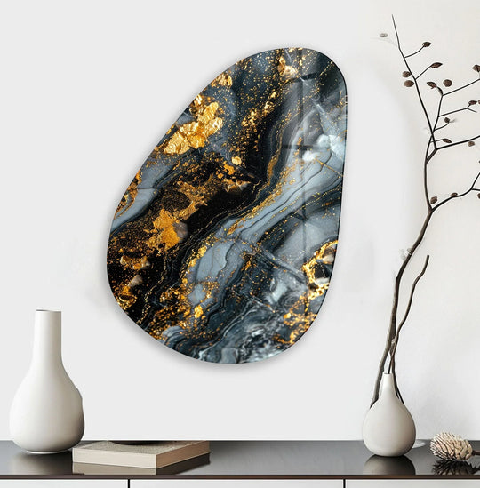 Deep, layered glass wall artwork features cascading veins of gold and charcoal on an asymmetrical oval canvas.