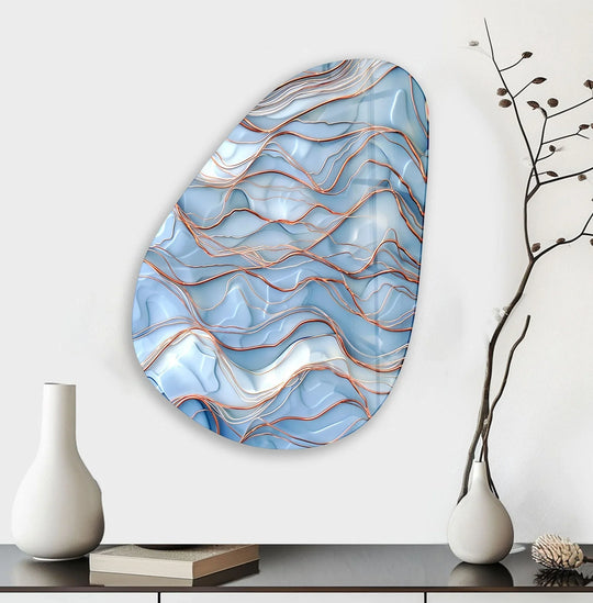 Asymmetrical oval blue golden marble print wall art with a unique, flowing edge design.