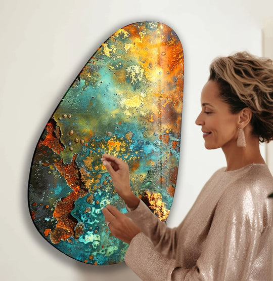 A woman admires a colorful abstract glass wall art piece, capturing a moment of decorative wall art stillness.