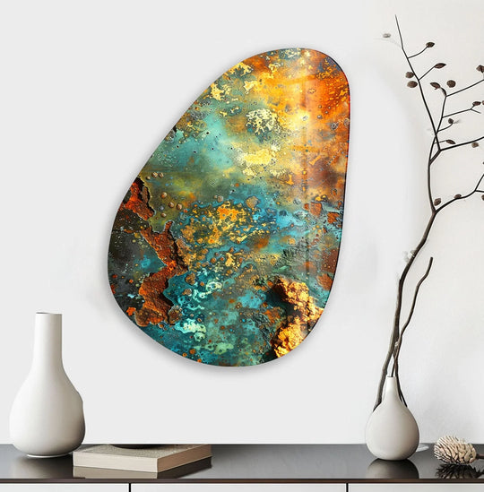 Asymmetrical oval glass wall art with a distressed, oxidized metal finish in vibrant abstract hues.