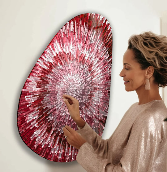 This oval red abstract glass wall art, featuring cool tones and a bright central glow, makes for the best glass art.