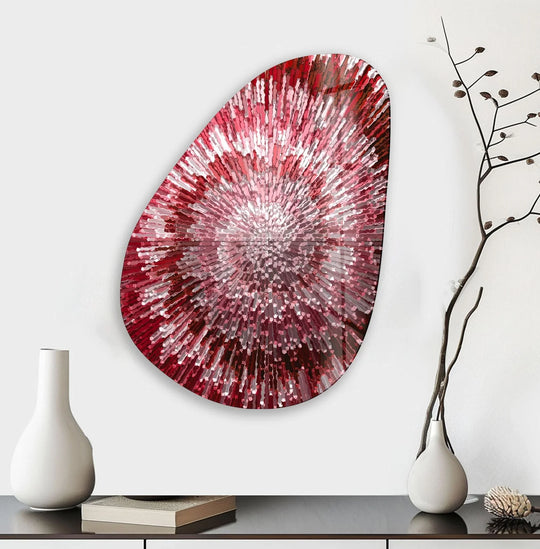 Asymmetrical oval red abstract glass wall art features a sunburst edge with vibrant reds and whites, adding a dynamic touch to home decor.