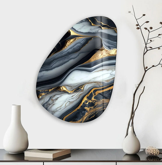 Asymmetrical oval glass wall art showcases striking depth and layers of white, black, and gold veining, creating unique modern wall decor.