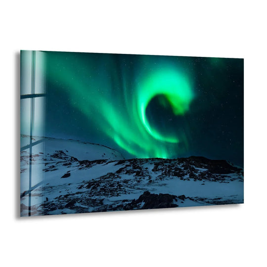 Horizontal tempered glass wall art showcases the aurora borealis swirling above a snowy, rocky landscape, creating a mesmerizing and shaped scene.