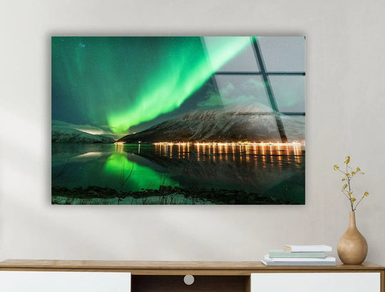 Gleaming and fluid, the Aurora Borealis appears to surge across the night sky in this breathtaking aurora borealis green glass wall art prints.