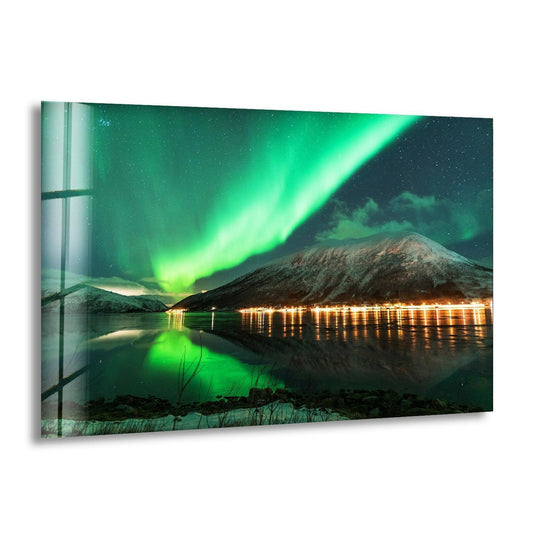 Negative space frames the reflected unique modern wall decor of the Aurora Borealis green glass wall art and snow-dusted mountain.