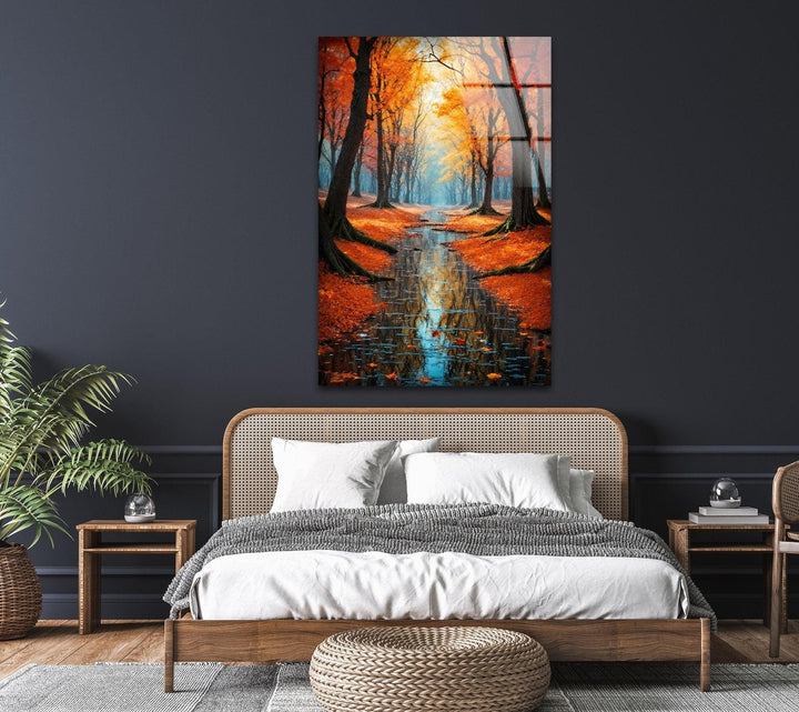 Stunning glass wall art depicting an autumn forest pathway surrounded by vibrant fall foliage.
