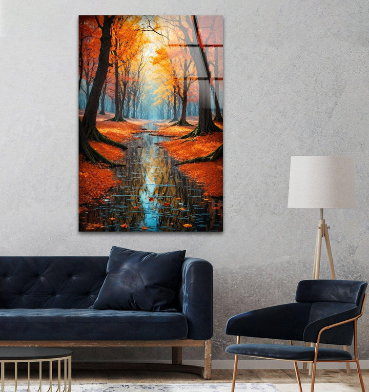Peaceful forest scene in autumn with vibrant trees and reflective water, captured on glass.
