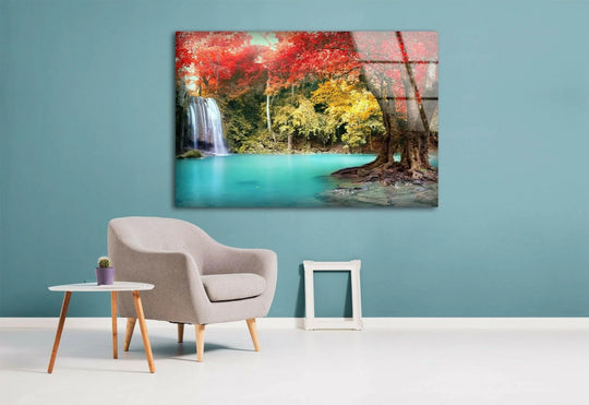 Landscape glass wall art shows autumn forest and waterfall scene in bright colors and it is a stunning decor piece perfect for nature lovers