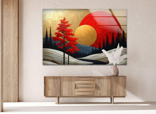 Negative space around the abstract red sun and scenic mountain scene in this glass art highlights the interplay of shapes within the decorative wall art.