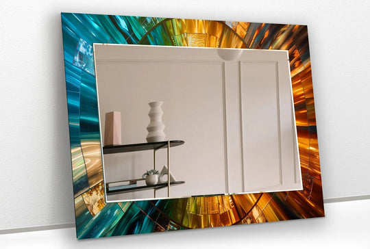 A Modern Mirror with an abstract design in vibrant blue and gold tones and tempered glass wall decor reflects a light room