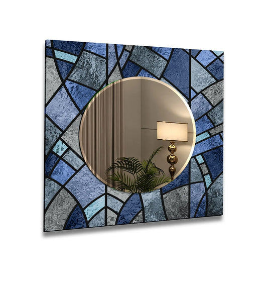 The mirror art has a blue geometric pattern and is a stained wall mirror with a round center glass design and modern aesthetic